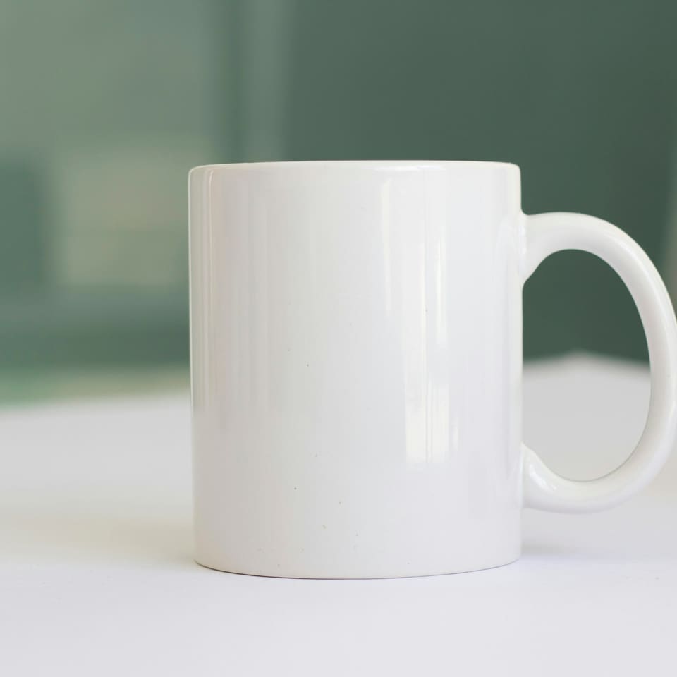 A plain white mug on a table
